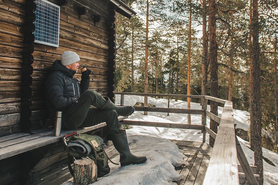 A man sitting and drinking coffee